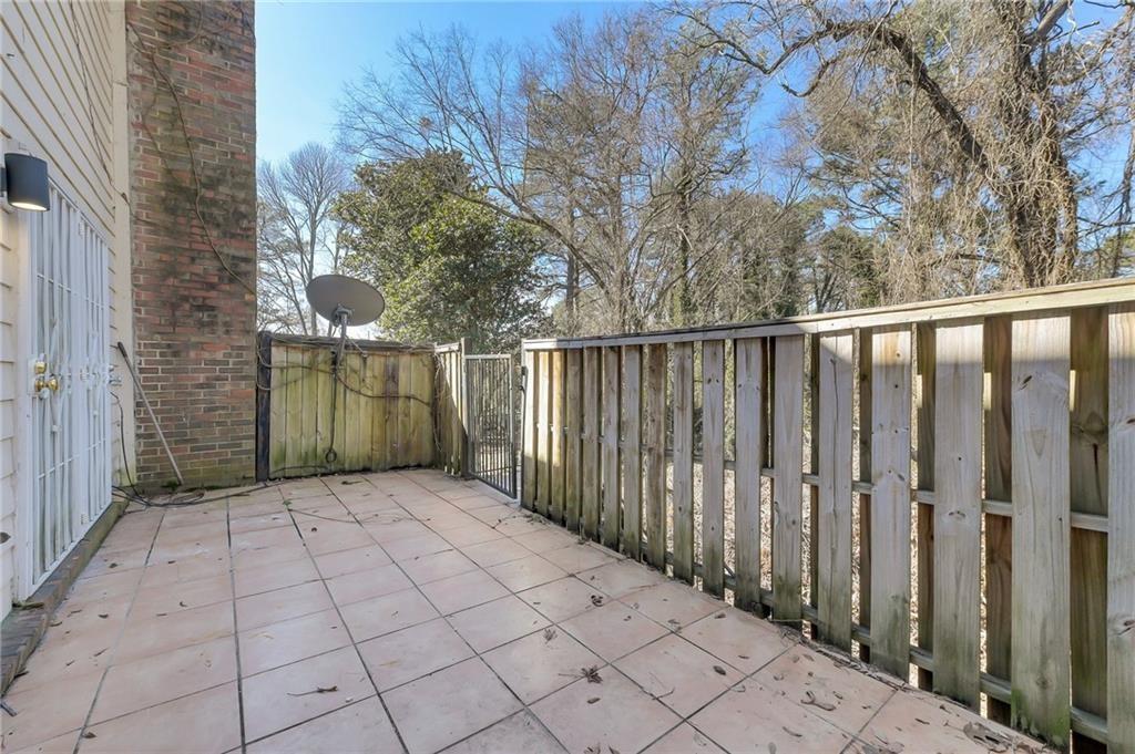 156 Glen Acres Court Decatur, GA 30035 - Photo 15 of 15 a view of a pathway with a wrought fence
