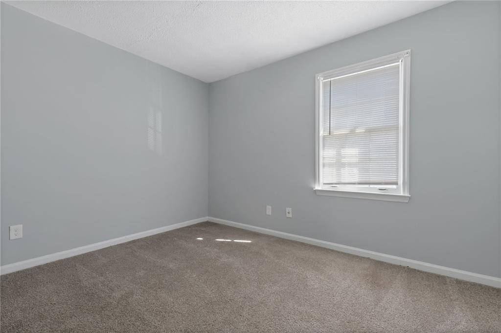 156 Glen Acres Court Decatur, GA 30035 - Photo 8 of 15 an empty room with a window