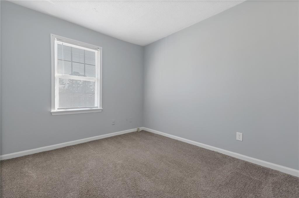 156 Glen Acres Court Decatur, GA 30035 - Photo 9 of 15 an empty room with a window