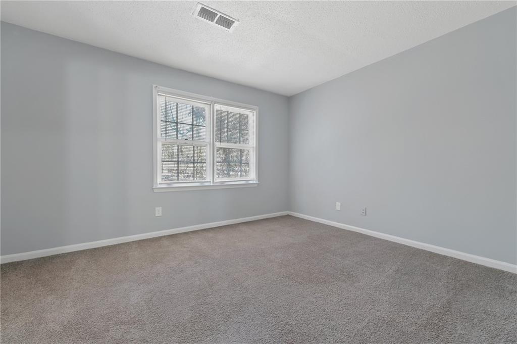156 Glen Acres Court Decatur, GA 30035 - Photo 10 of 15 an empty room with windows