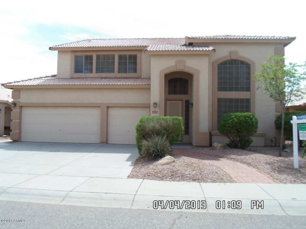 4047 East Agave Road Phoenix, AZ 85044 - Photo 1 of 20 a view of a house with potted plants