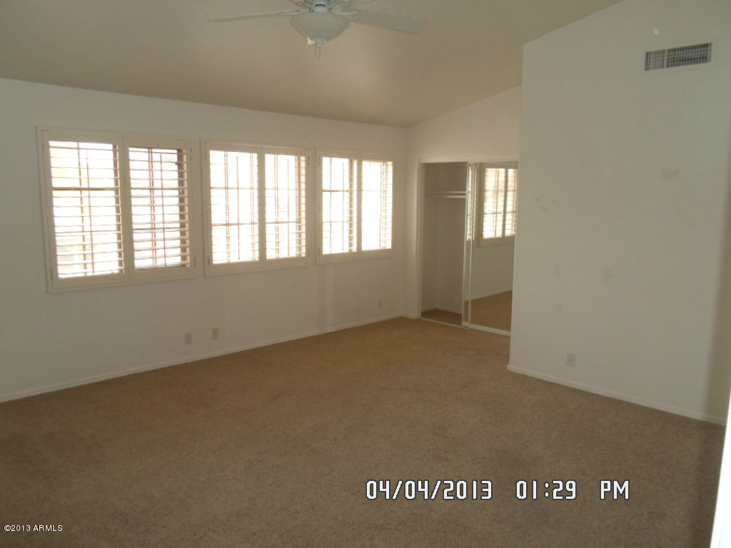 4047 East Agave Road Phoenix, AZ 85044 - Photo 12 of 20 an empty room with a window