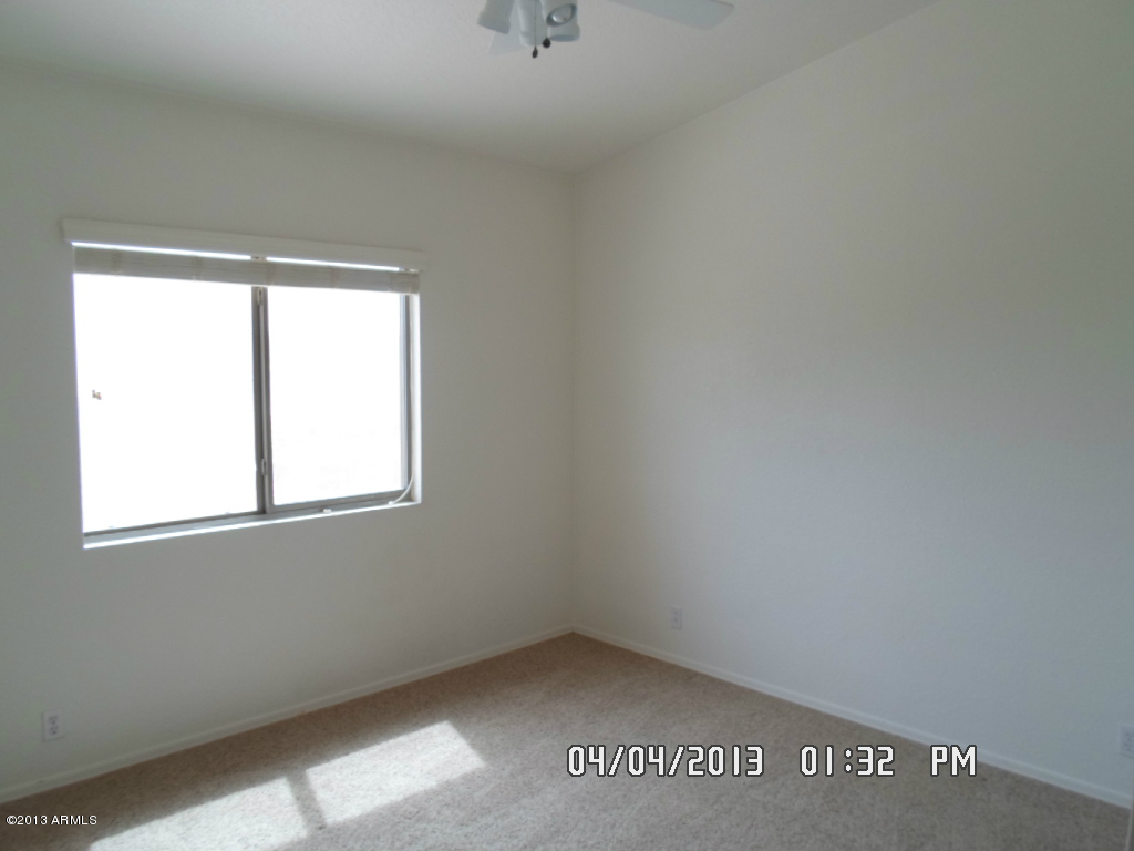4047 East Agave Road Phoenix, AZ 85044 - Photo 17 of 20 an empty room with a window
