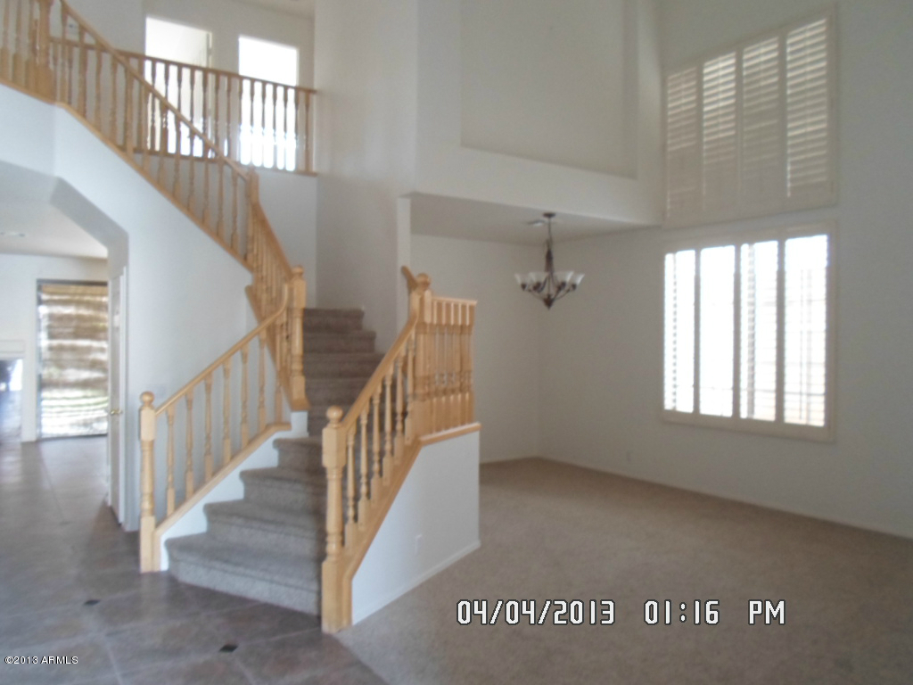 4047 East Agave Road Phoenix, AZ 85044 - Photo 2 of 20 a view of an entryway with staircase
