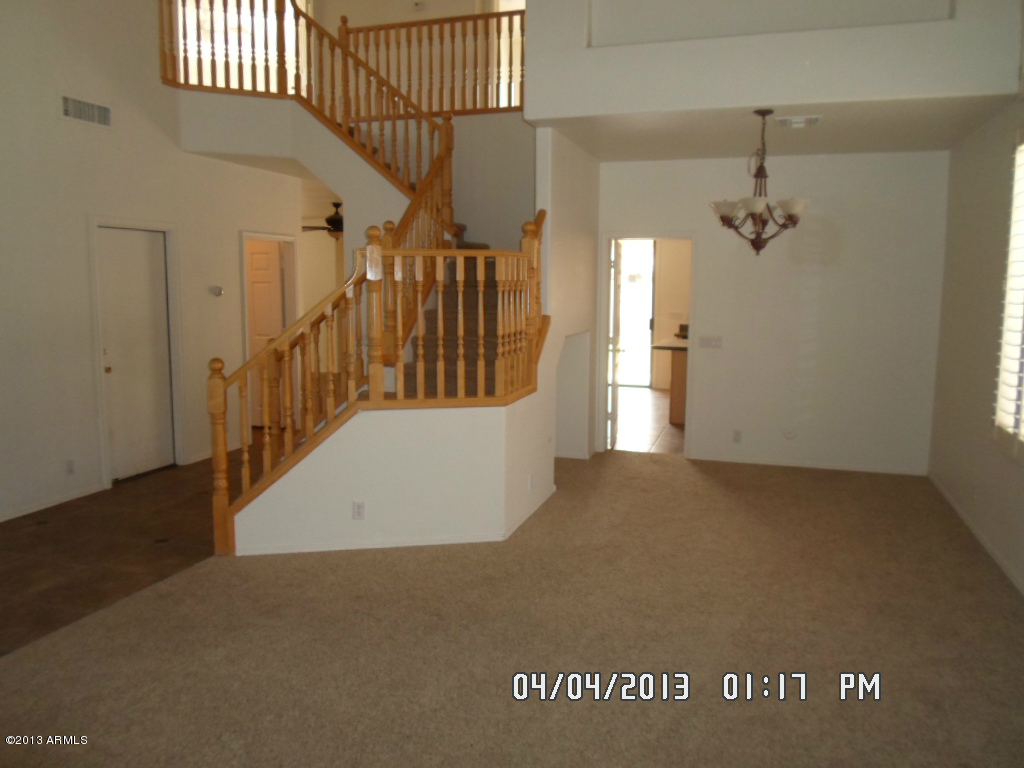 4047 East Agave Road Phoenix, AZ 85044 - Photo 3 of 20 a view of a hallway with stairs