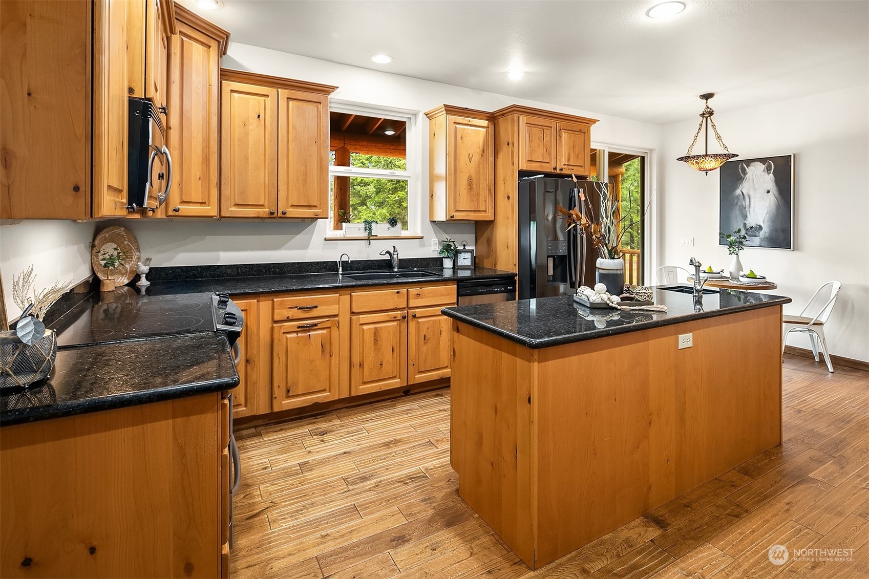 111 Chandler Road Cle Elum, WA 98922 - Photo 11 of 36 a kitchen with stainless steel appliances granite countertop a sink a stove and a refrigerator