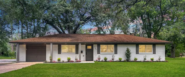 a view of a house with a garden
