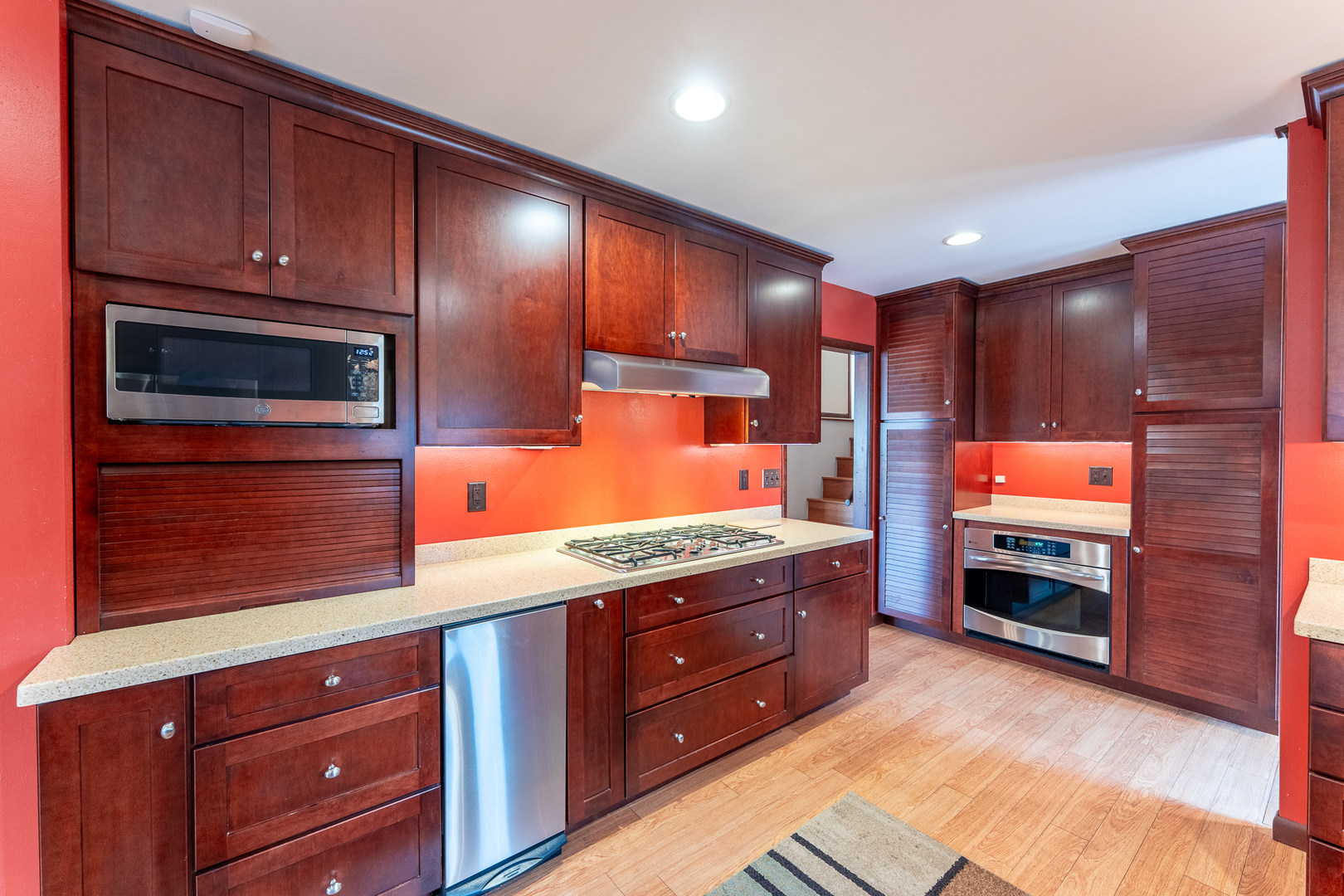 212 Kane Drive Herrin, IL 62948 - Photo 13 of 44 a kitchen with stainless steel appliances granite countertop wooden cabinets and a stove top oven