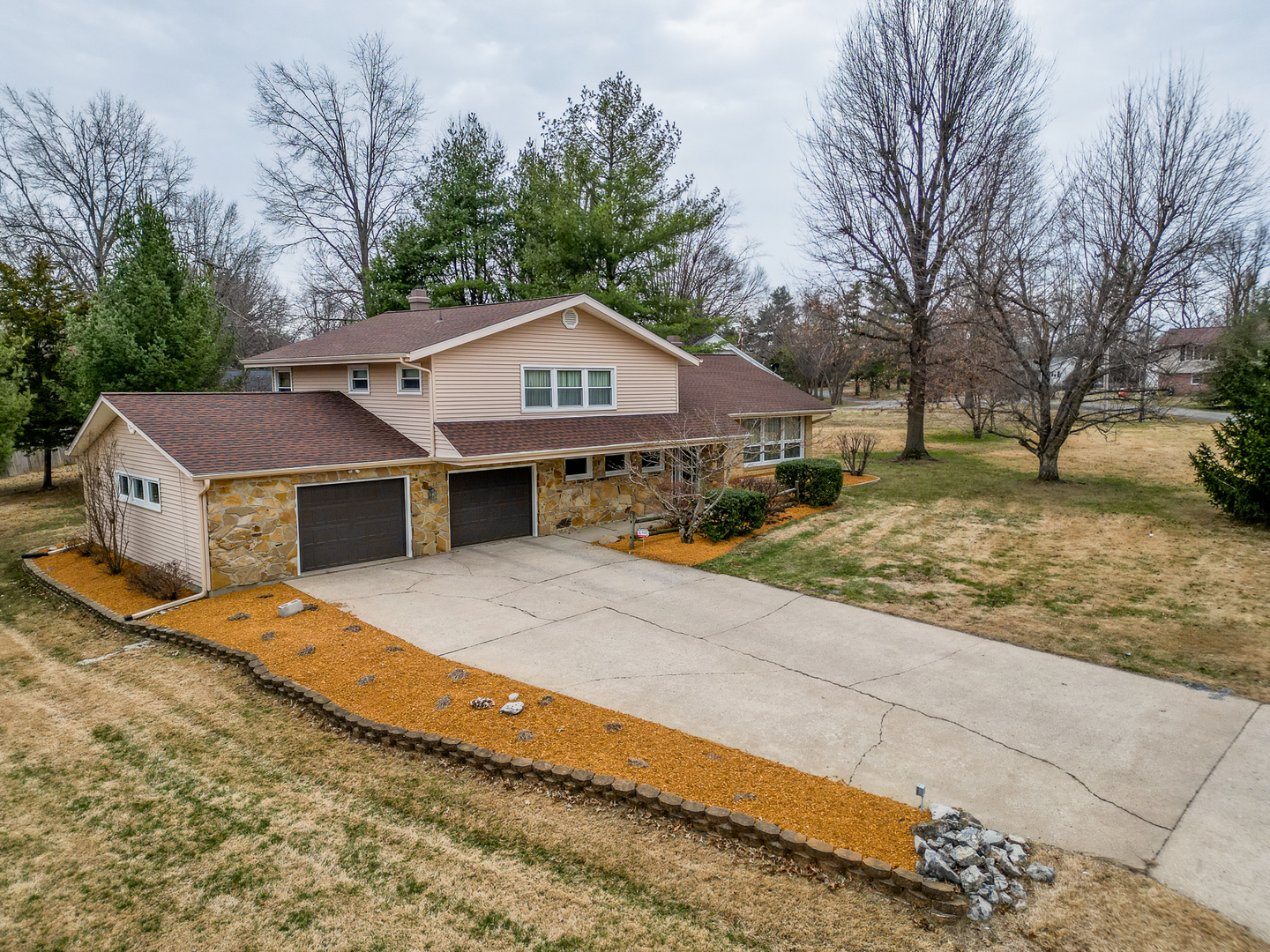 212 Kane Drive Herrin, IL 62948 - Photo 2 of 44 a front view of a house with a yard covered with snow in front of house