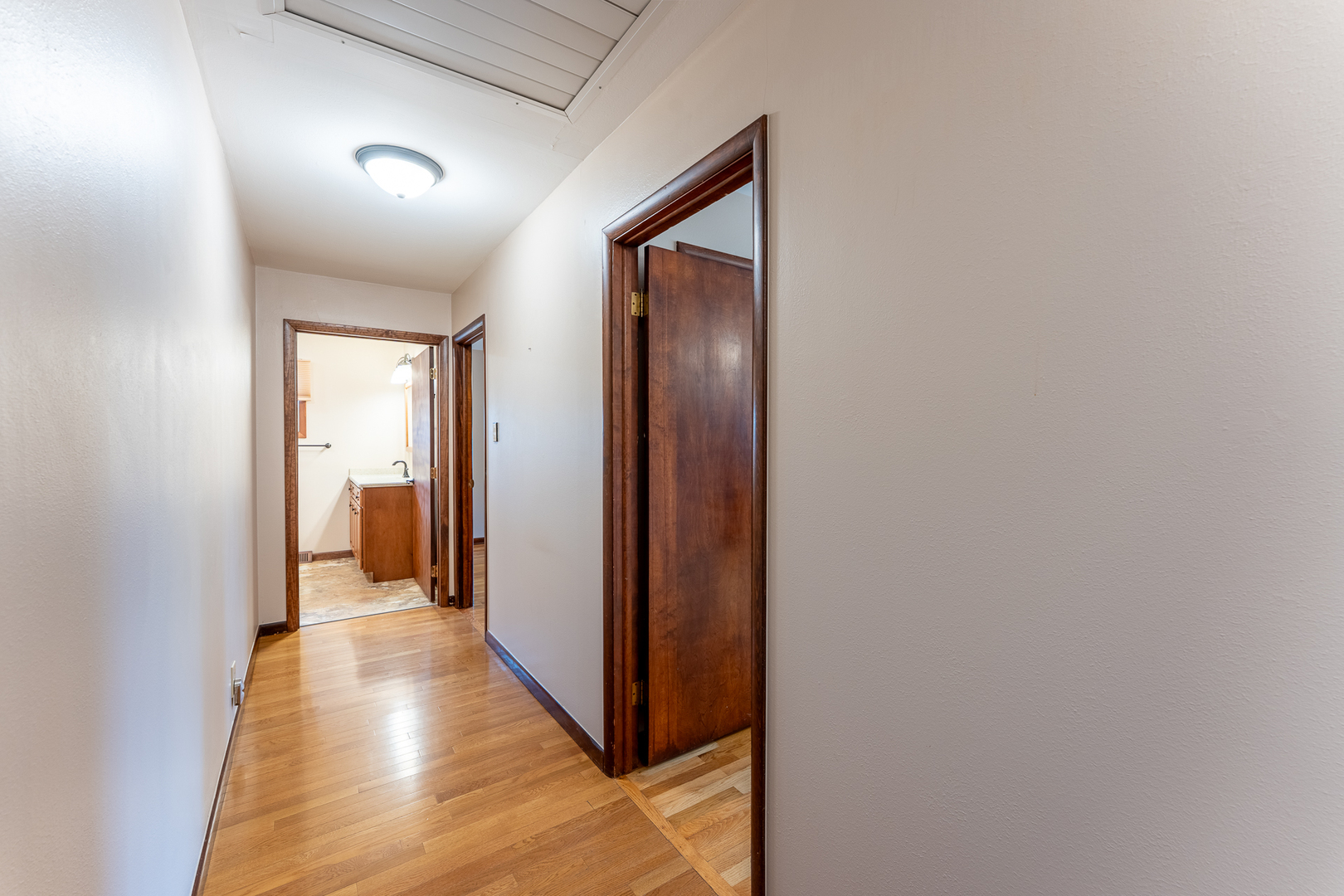 212 Kane Drive Herrin, IL 62948 - Photo 22 of 44 a view of a hallway with wooden floor