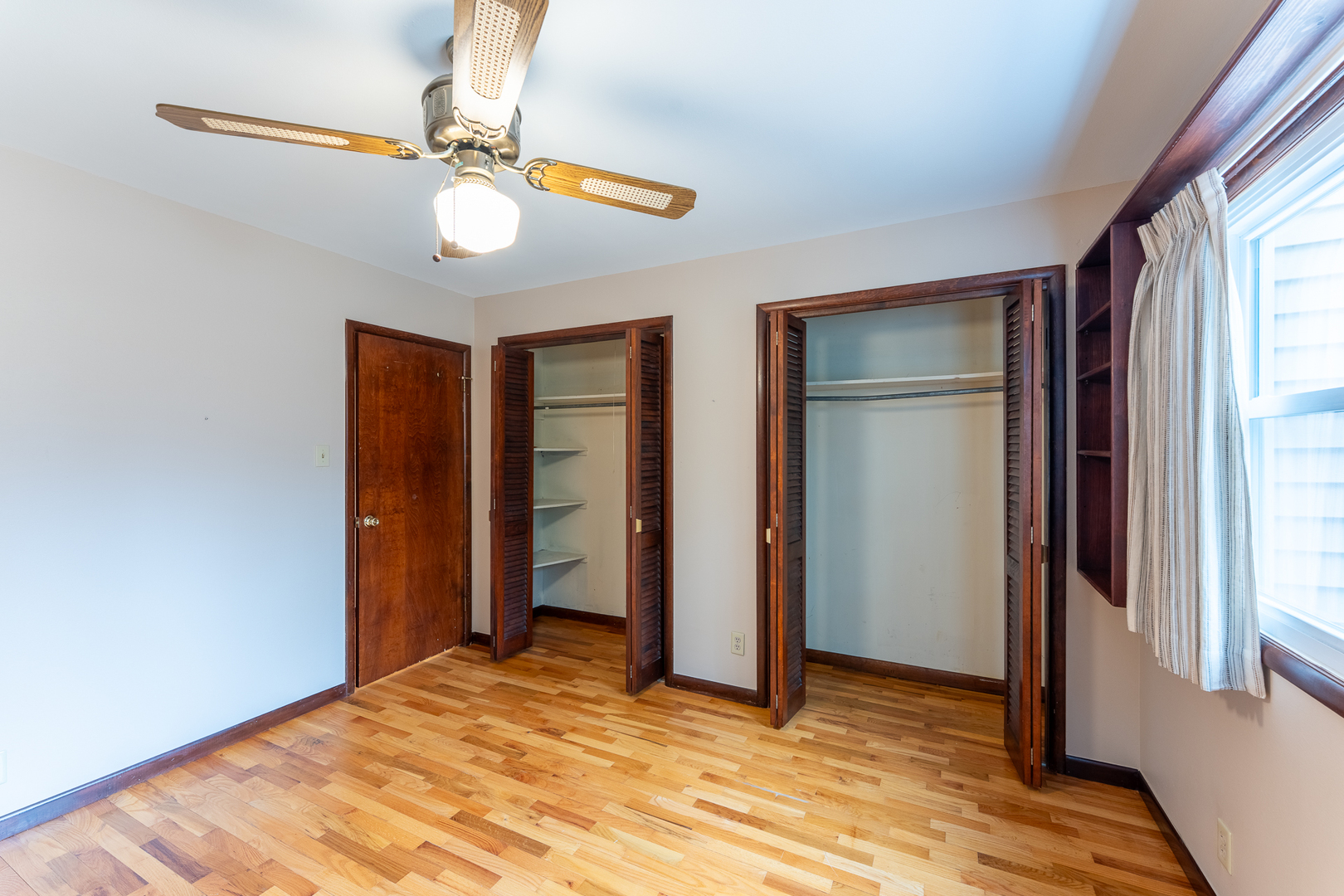 212 Kane Drive Herrin, IL 62948 - Photo 24 of 44 a view of an empty room with window and wooden floor