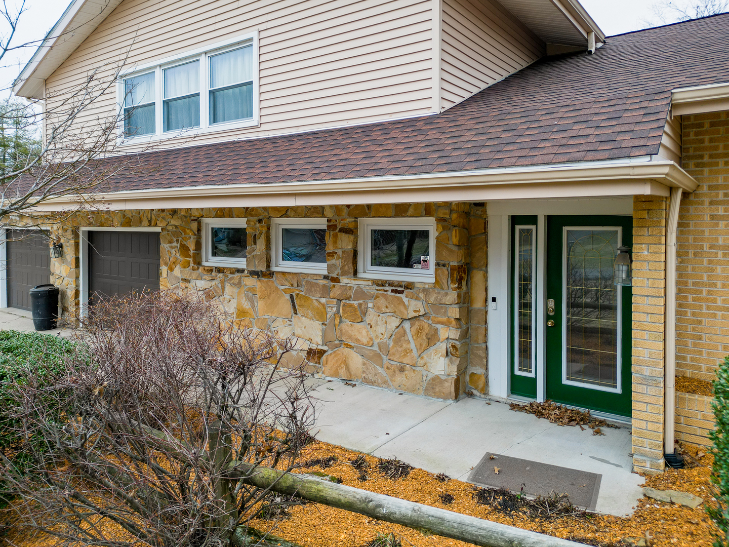 212 Kane Drive Herrin, IL 62948 - Photo 5 of 44 a front view of a house with large windows
