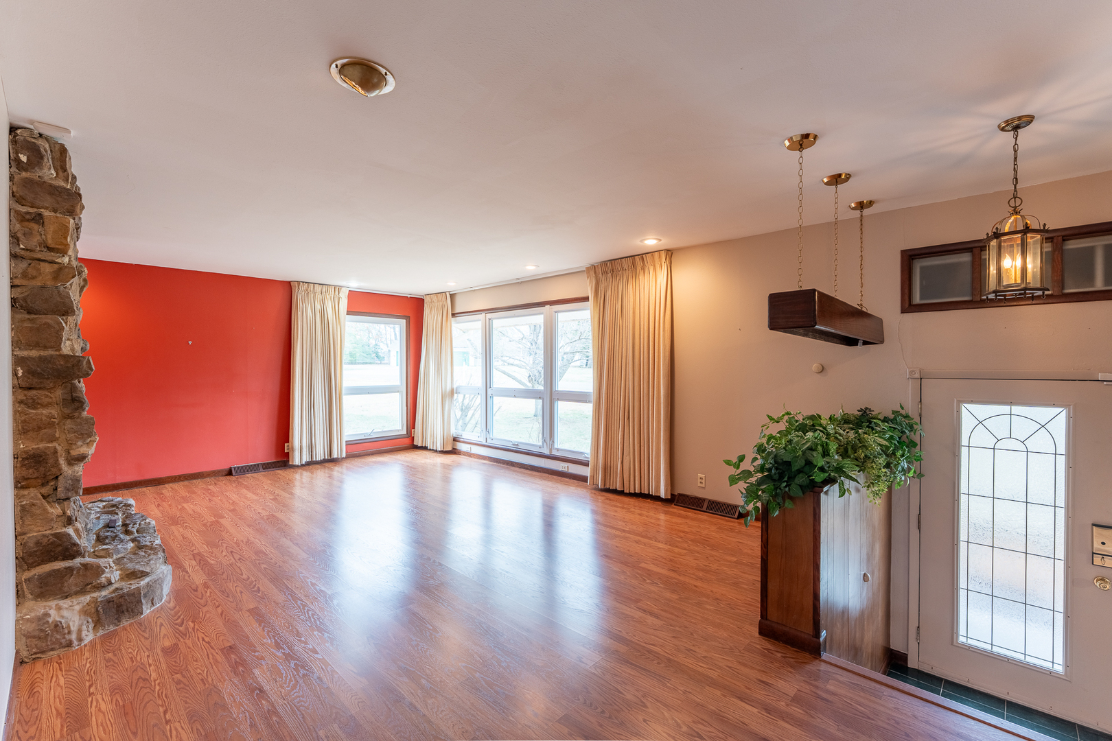 212 Kane Drive Herrin, IL 62948 - Photo 6 of 44 a view of an empty room with wooden floor and a window
