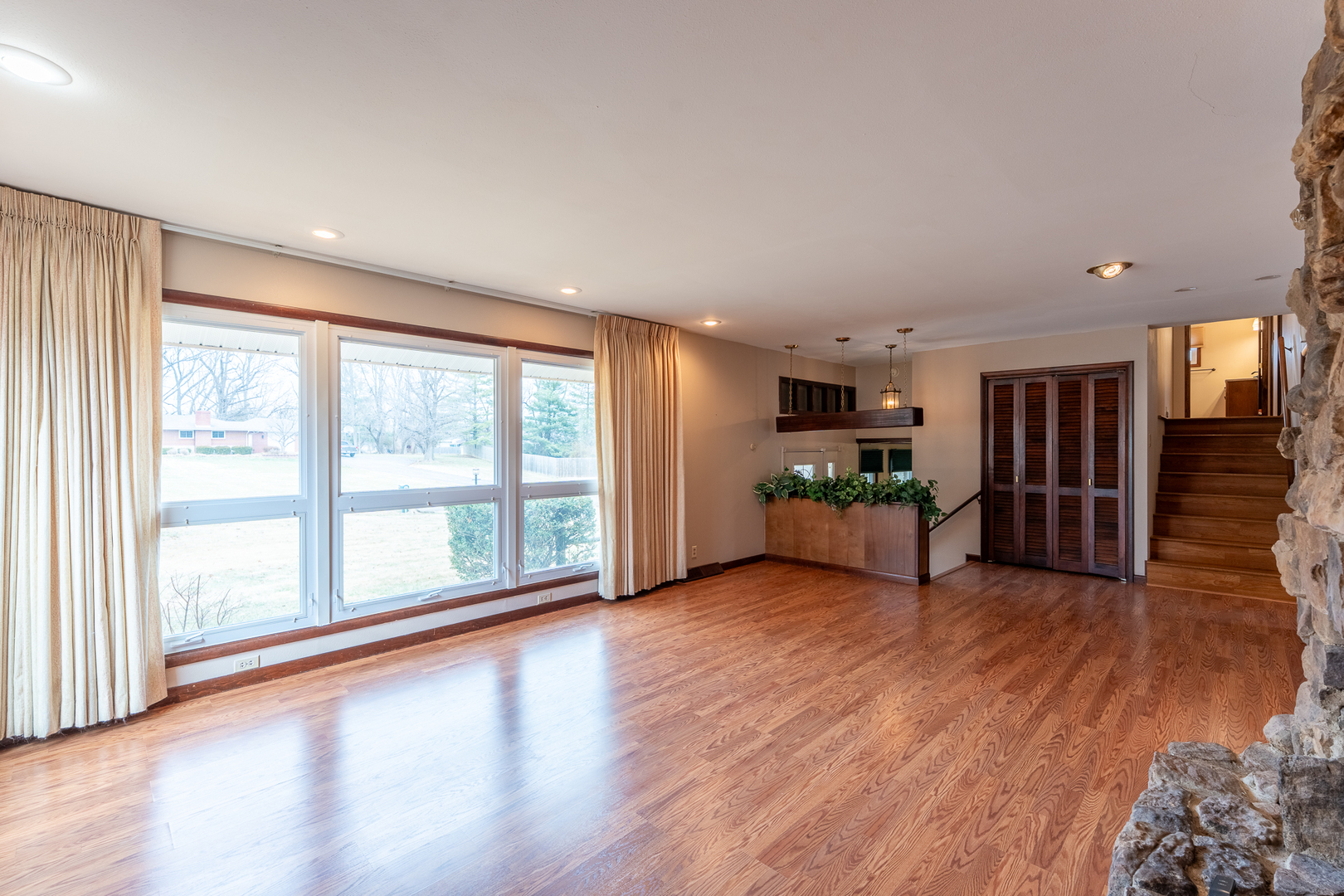 212 Kane Drive Herrin, IL 62948 - Photo 7 of 44 a view of a big room with wooden floor and windows