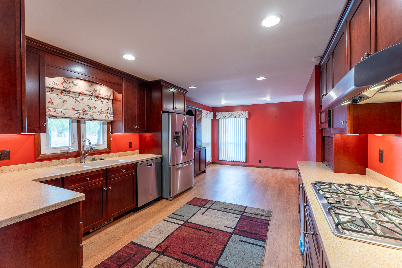 212 Kane Drive Herrin, IL 62948 - Photo 10 of 44 a large kitchen with stainless steel appliances granite countertop a sink and dishwasher a stove with wooden floor