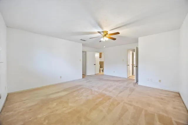 a bathroom with a shower and a toilet