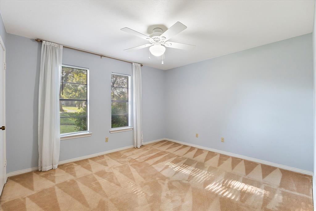 2733 Biloxi Lane Mesquite, TX 75150 - Photo 23 of 28 a view of an empty room with wooden floor and a window