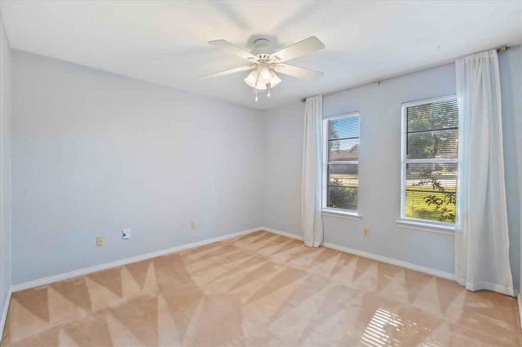 2733 Biloxi Lane Mesquite, TX 75150 - Photo 24 of 28 wooden floor in an empty room with a window