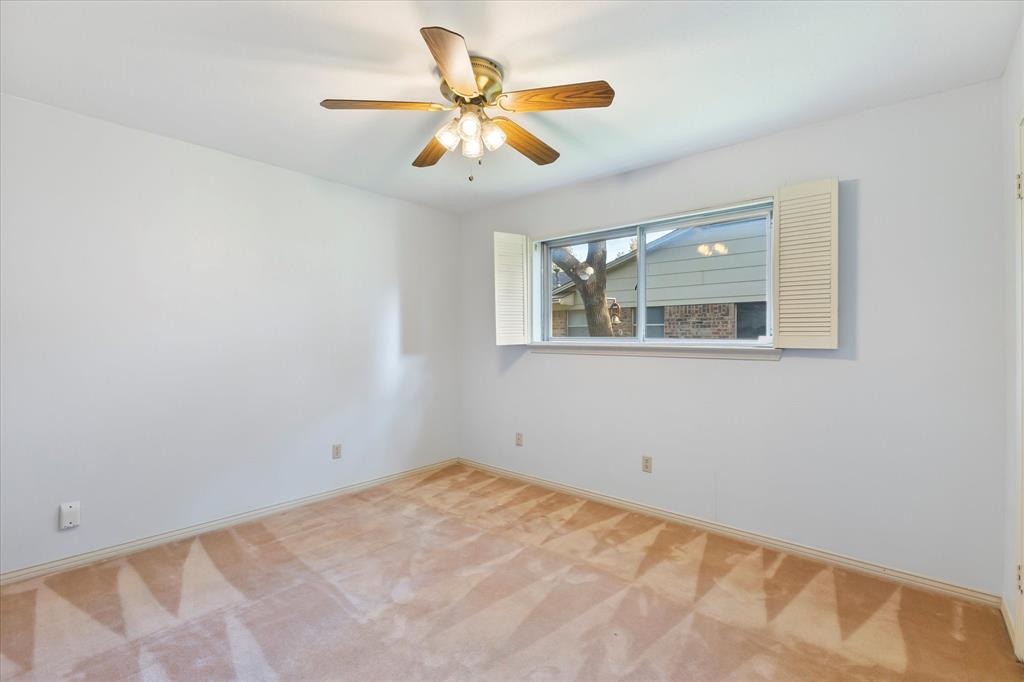 2733 Biloxi Lane Mesquite, TX 75150 - Photo 25 of 28 a view of a big room with wooden floor and a ceiling fan