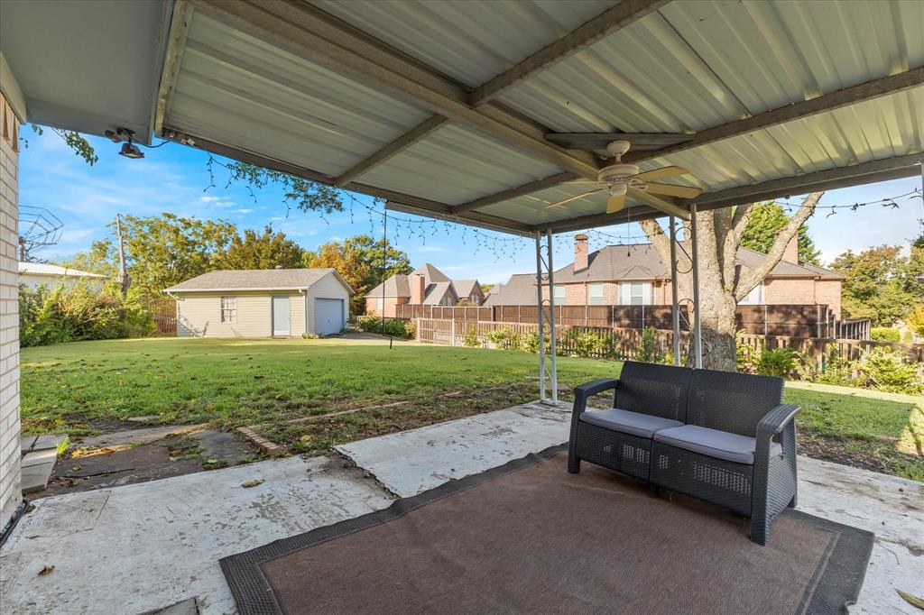 2733 Biloxi Lane Mesquite, TX 75150 - Photo 26 of 28 a view of patio with a table and chairs under an umbrella