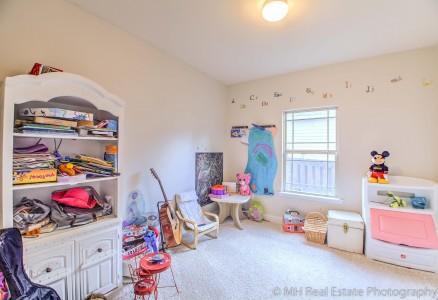674 Red Fern Road Crestview, FL 32536 - Photo 11 of 23 a playing room with toys and a couch
