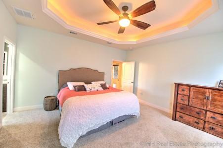 674 Red Fern Road Crestview, FL 32536 - Photo 14 of 23 a bedroom with a bed and a chandelier