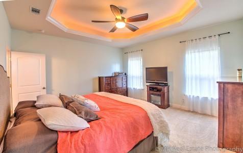 674 Red Fern Road Crestview, FL 32536 - Photo 15 of 23 a bedroom with a bed and a flat screen tv