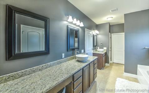 674 Red Fern Road Crestview, FL 32536 - Photo 16 of 23 a bathroom with a granite countertop sink and a mirror