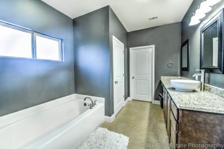 674 Red Fern Road Crestview, FL 32536 - Photo 18 of 23 a spacious bathroom with a granite countertop tub sink and mirror