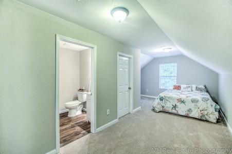 674 Red Fern Road Crestview, FL 32536 - Photo 21 of 23 a spacious bedroom with a bed and a lamp
