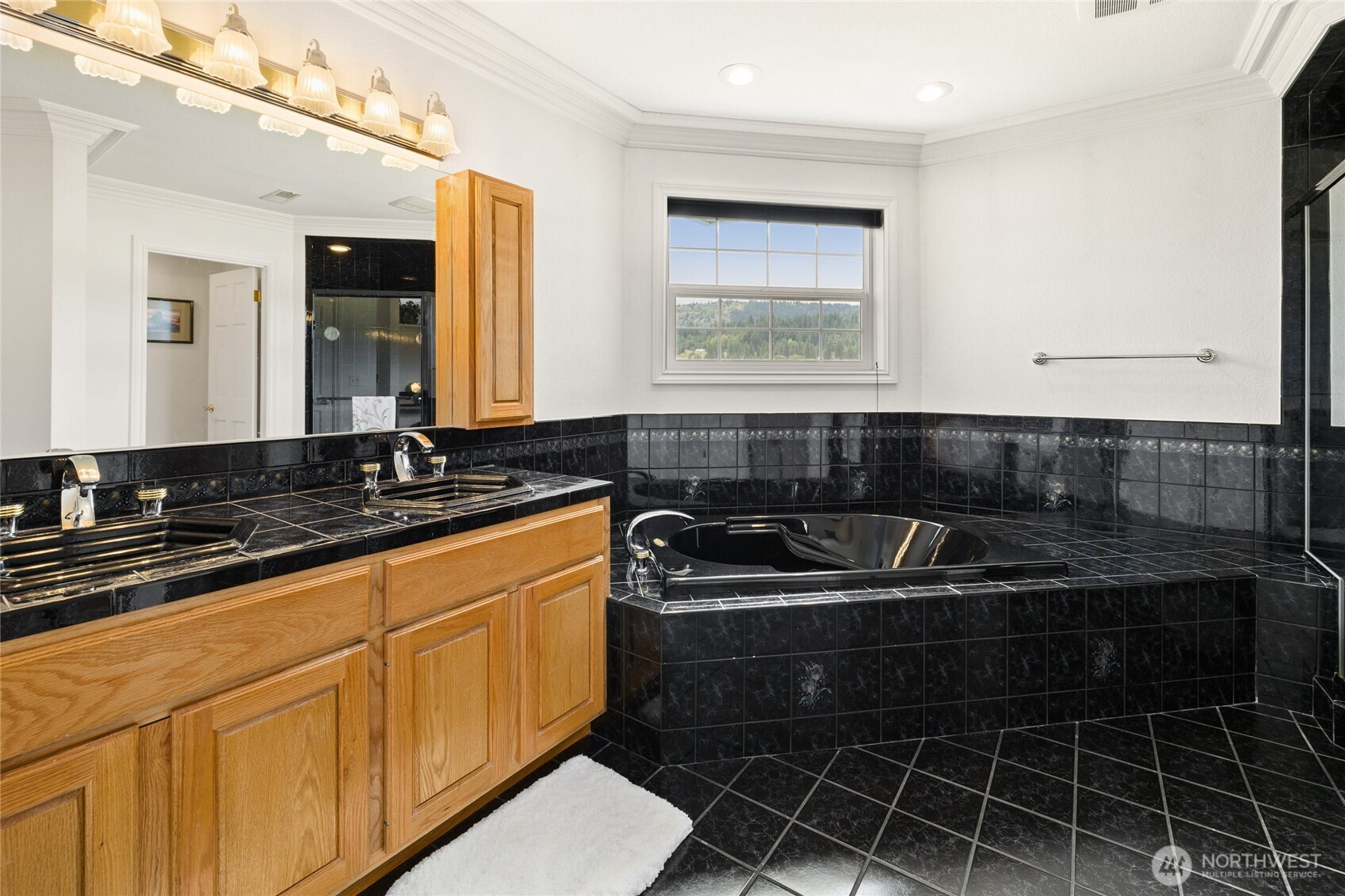 6280 Lower Peoh Point Road Cle Elum, WA 98922 - Photo 22 of 38 a kitchen with a sink and cabinets