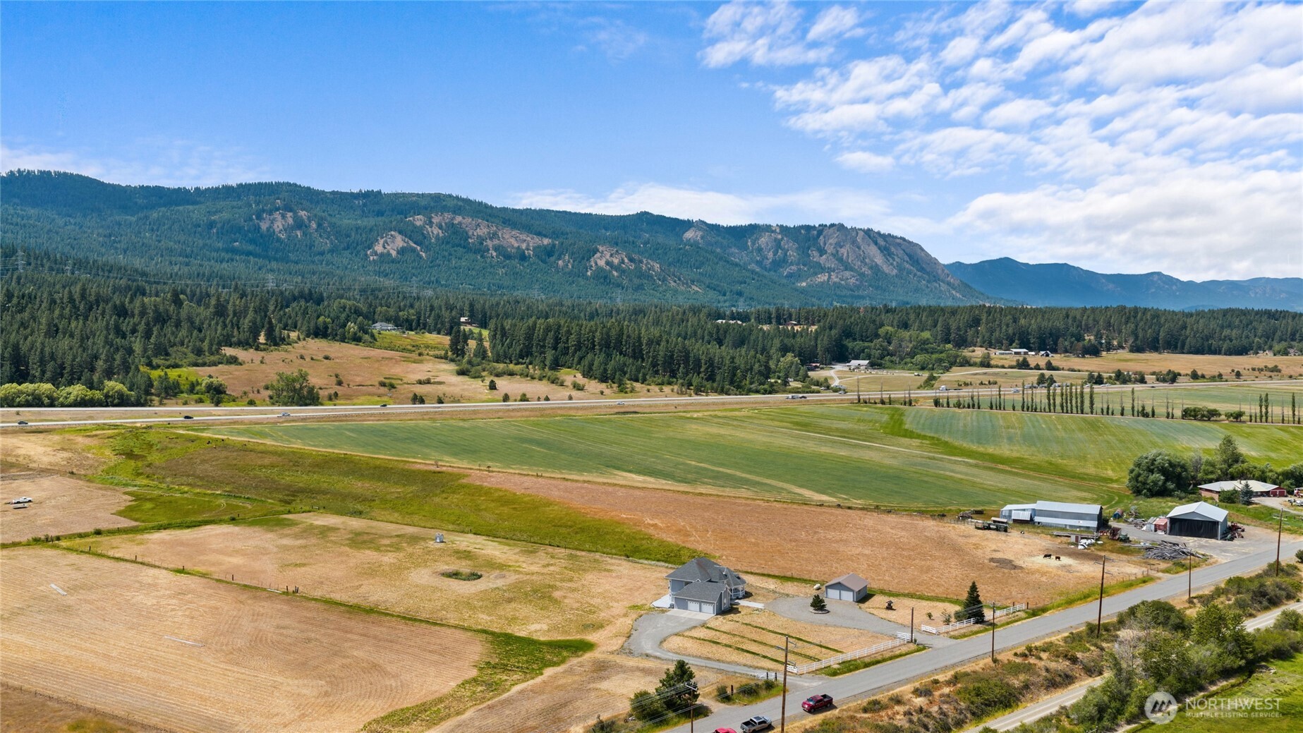 6280 Lower Peoh Point Road Cle Elum, WA 98922 - Photo 35 of 38 a view of a lake with a mountain in the background