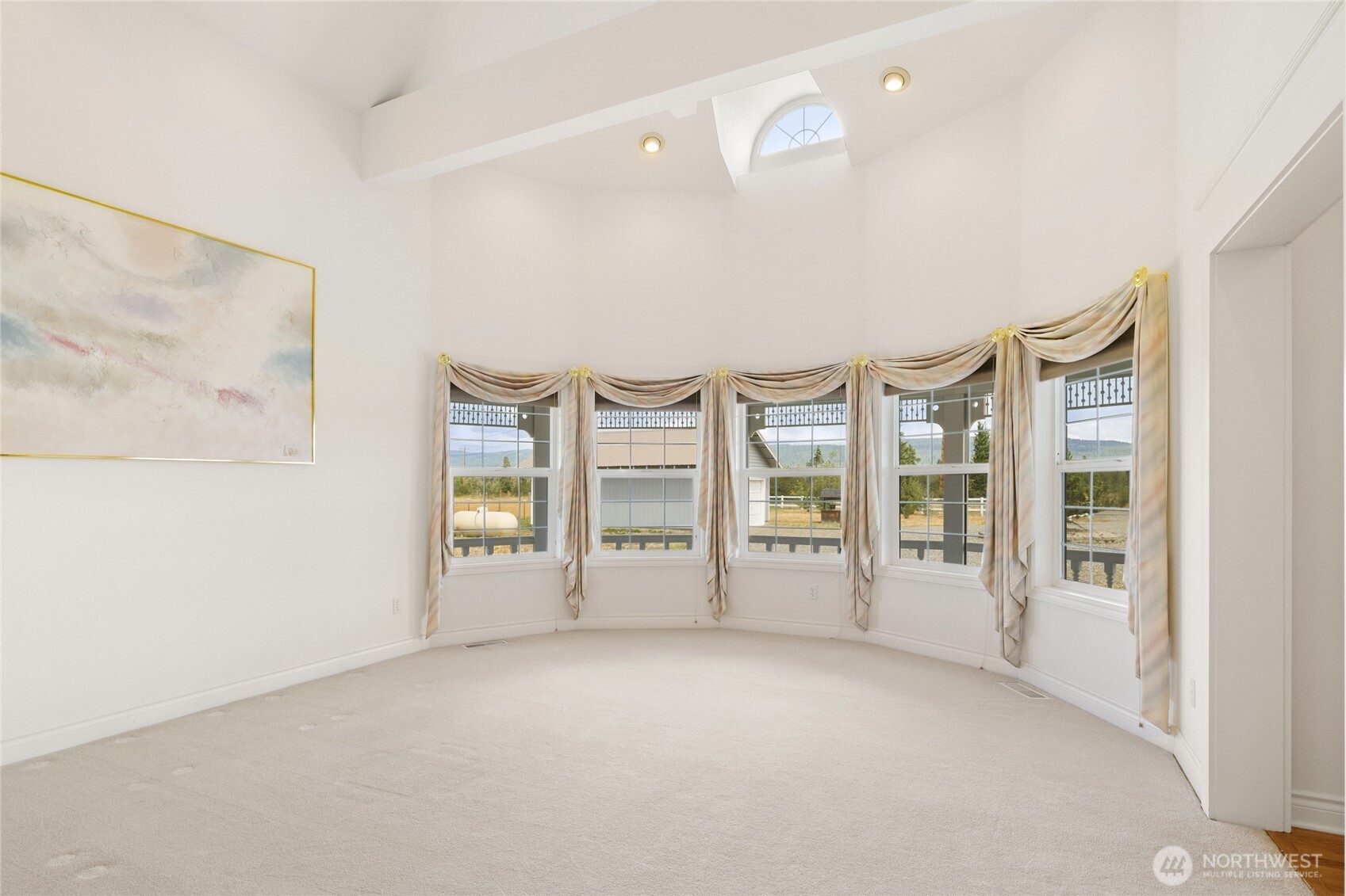 6280 Lower Peoh Point Road Cle Elum, WA 98922 - Photo 6 of 38 wooden floor in an empty room with a window