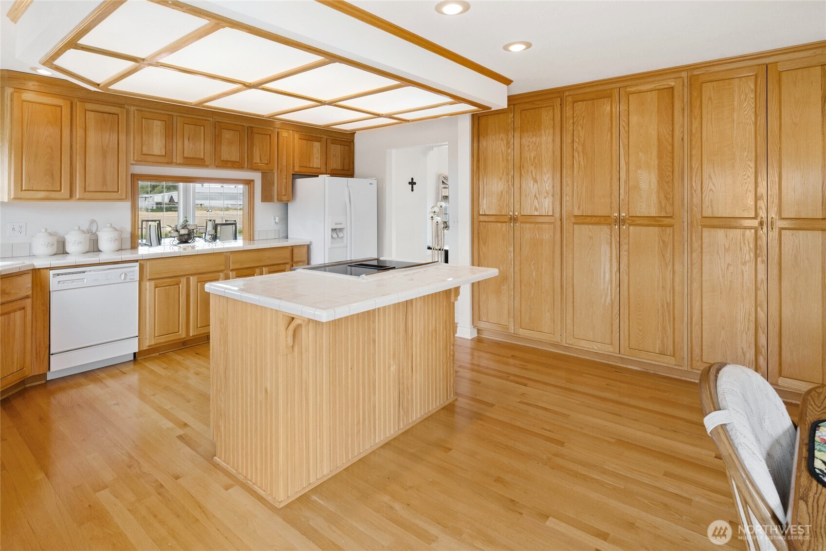6280 Lower Peoh Point Road Cle Elum, WA 98922 - Photo 8 of 38 a kitchen with wooden cabinets and window