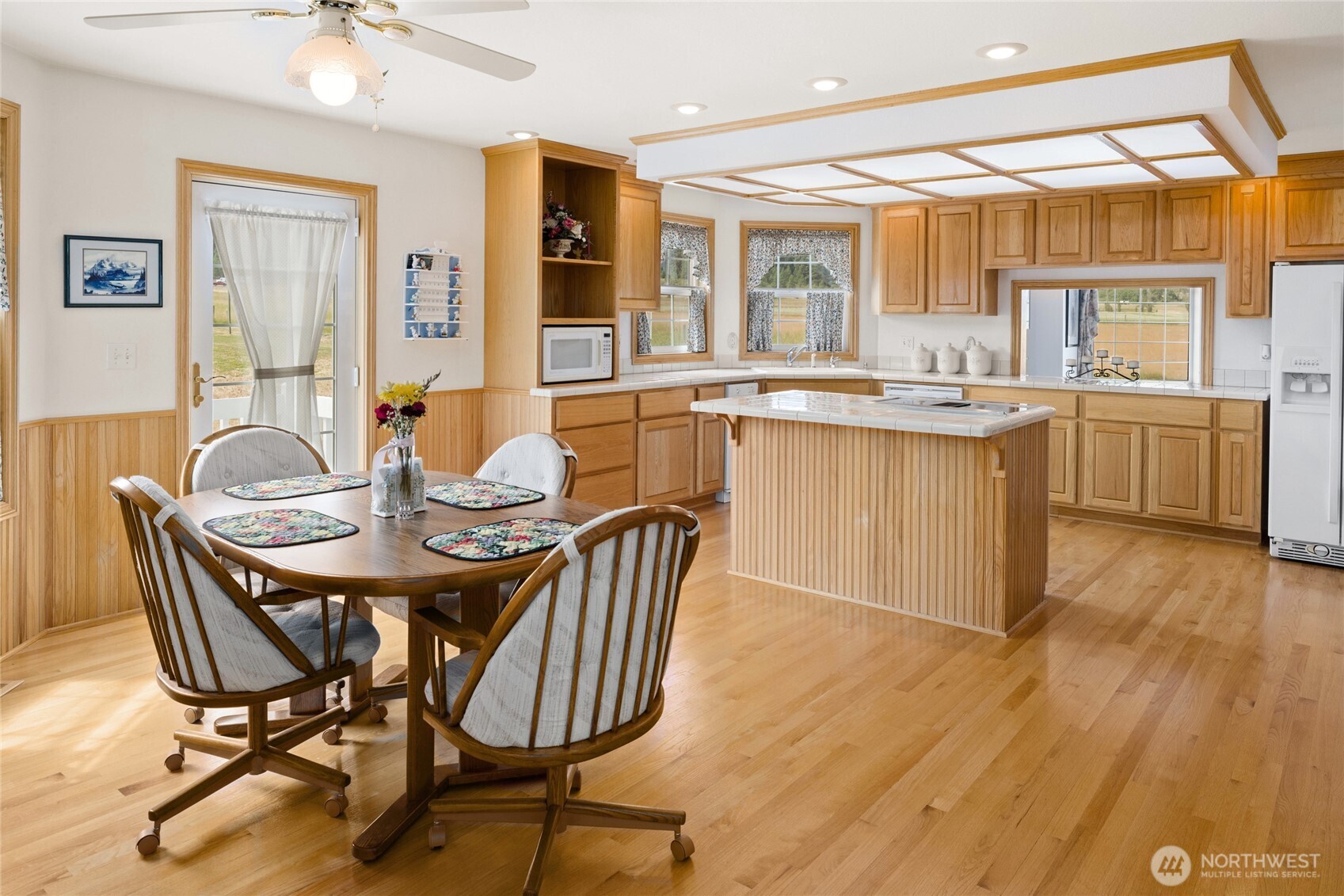 6280 Lower Peoh Point Road Cle Elum, WA 98922 - Photo 9 of 38 a view of a dining room with furniture and wooden floor