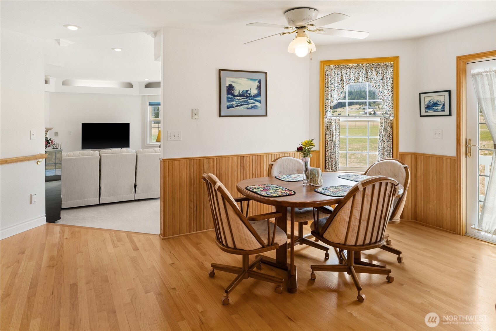 6280 Lower Peoh Point Road Cle Elum, WA 98922 - Photo 10 of 38 a view of a dining room with furniture window and wooden floor