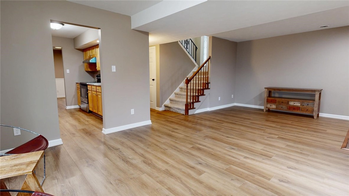 4153 Buckingham Drive Decatur, IL 62526 - Photo 5 of 34 a view of empty room with wooden floor and stairs