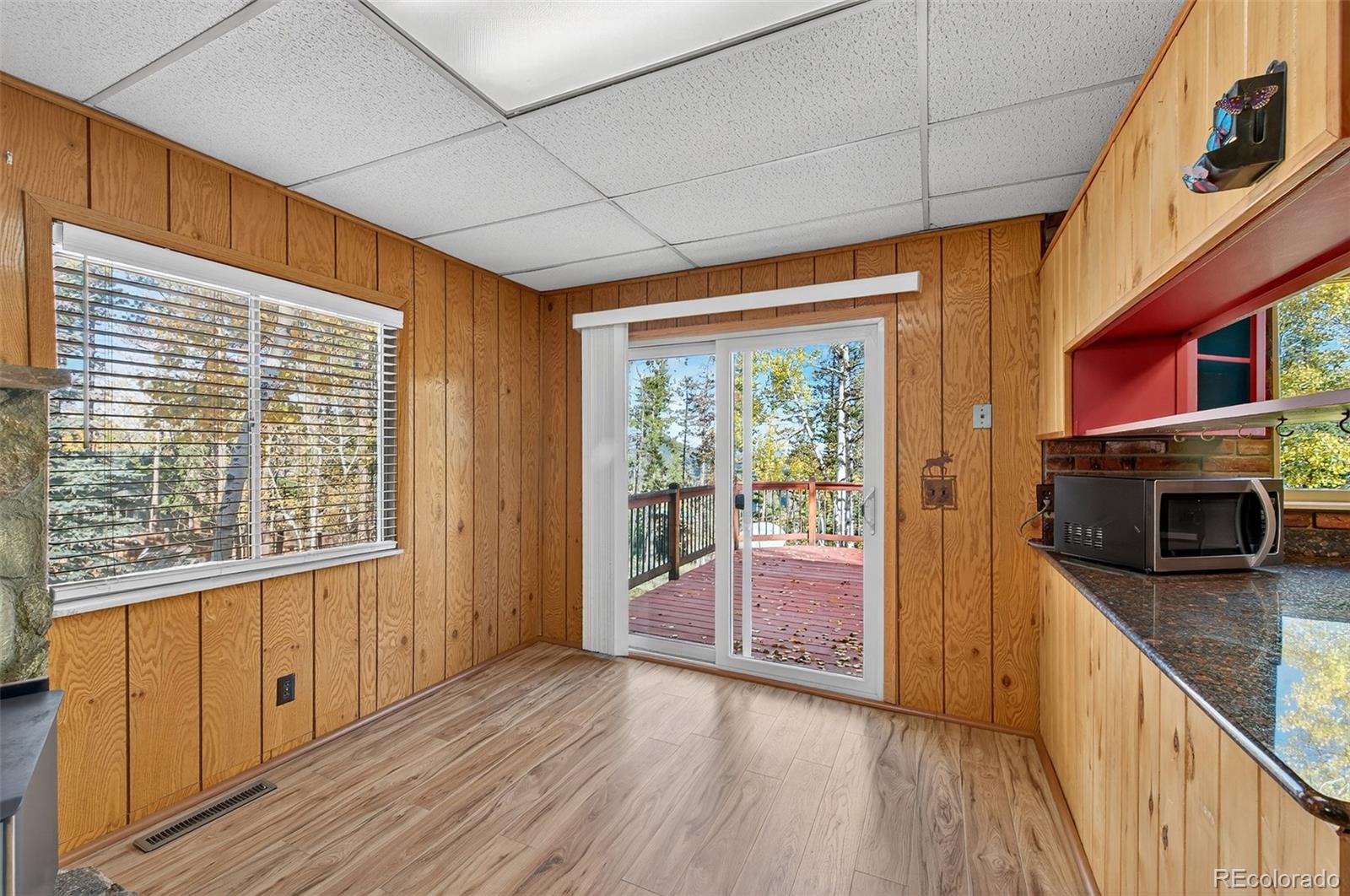 20341 Maxwell Drive Morrison, CO 80465 - Photo 13 of 47 a view of a hallway with wooden floor and windows