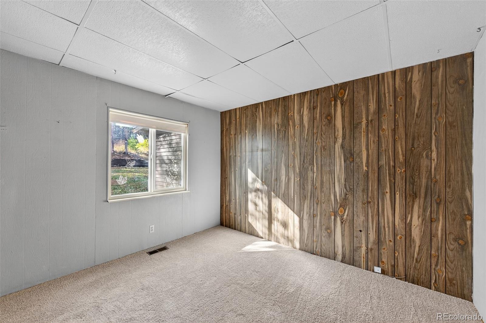 20341 Maxwell Drive Morrison, CO 80465 - Photo 20 of 47 a view of an empty room with a window