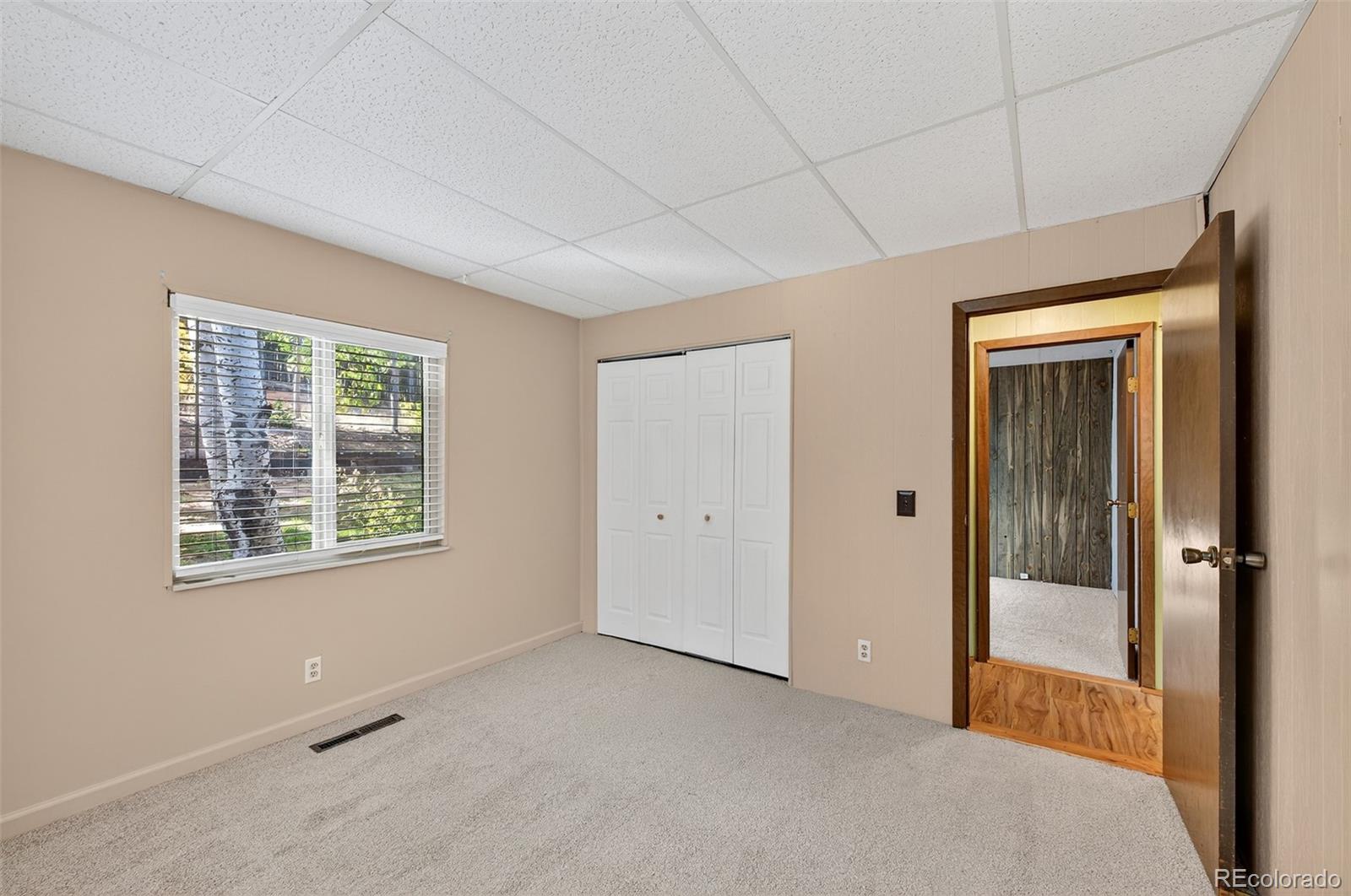 20341 Maxwell Drive Morrison, CO 80465 - Photo 21 of 47 a view of an empty room with a window