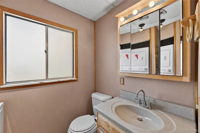 a balcony with wooden floor and fence