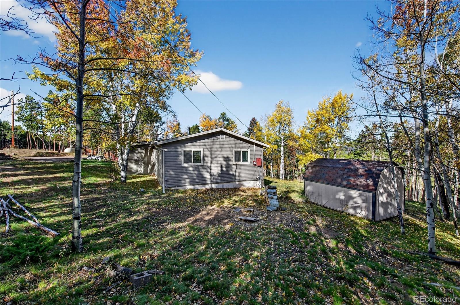 20341 Maxwell Drive Morrison, CO 80465 - Photo 28 of 47 a view of a house with a yard