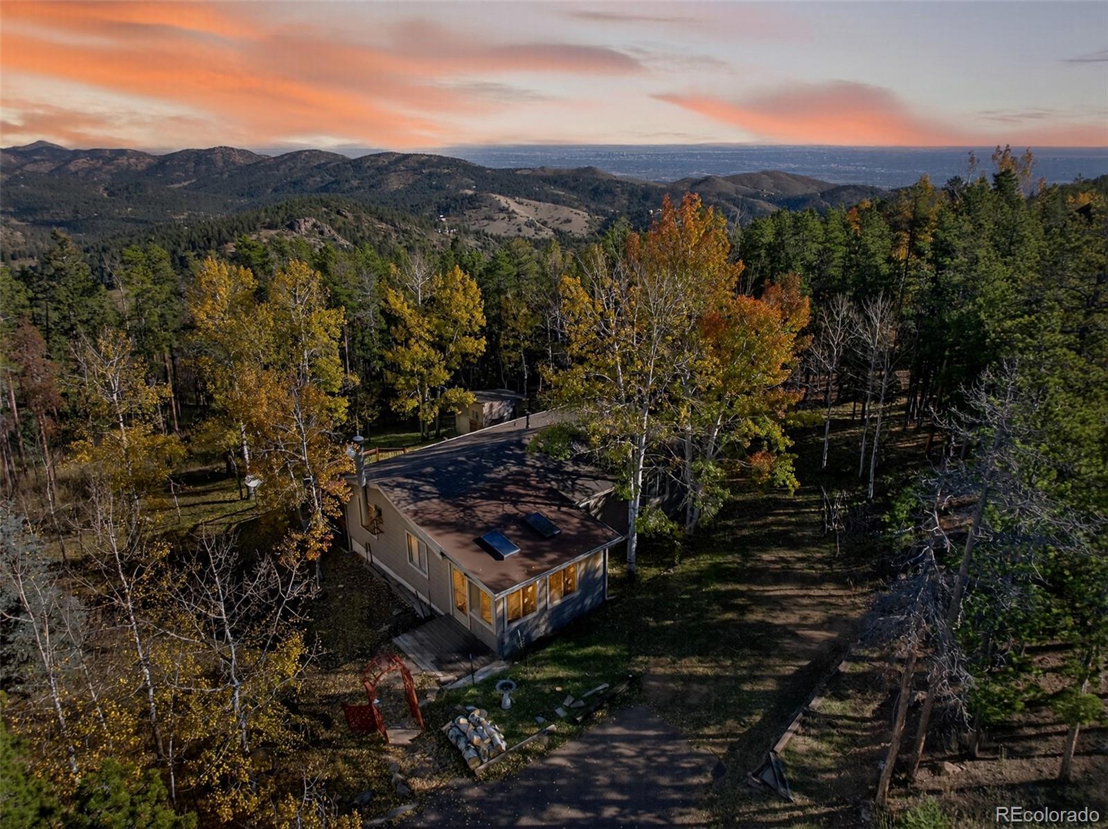 20341 Maxwell Drive Morrison, CO 80465 - Photo 5 of 47 a view of a city with mountains in the background