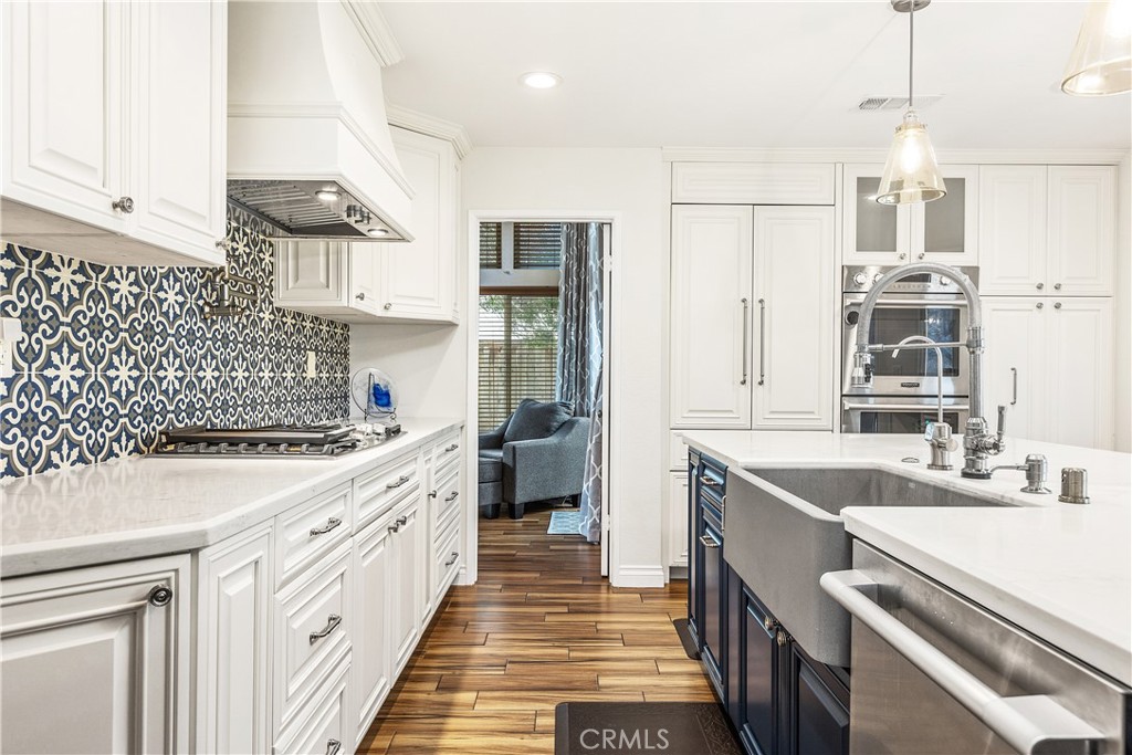 6059 Rio Valle Drive Bonsall, CA 92003 - Photo 17 of 46 Custom cabinets, vent hood and built in fridge