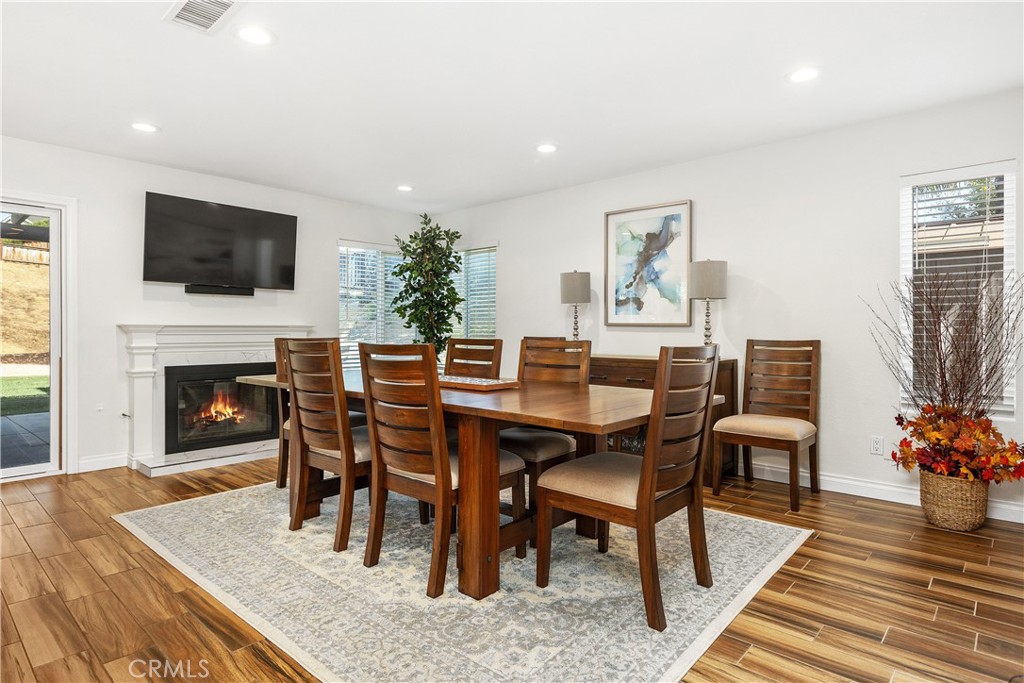 6059 Rio Valle Drive Bonsall, CA 92003 - Photo 23 of 46 Digitally altered fire in fireplace