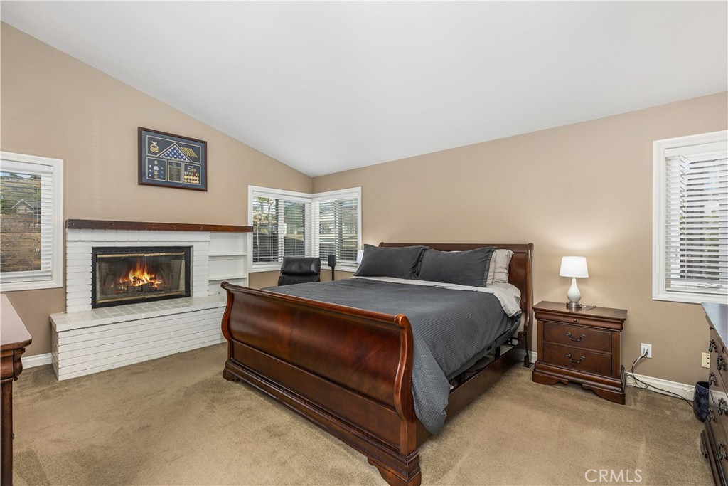 6059 Rio Valle Drive Bonsall, CA 92003 - Photo 29 of 46 Fireplace in primary: digitally altered fire in fireplace