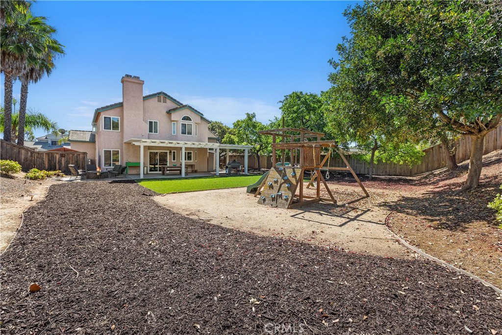 6059 Rio Valle Drive Bonsall, CA 92003 - Photo 43 of 46 Digitally altered fire added to fire pit