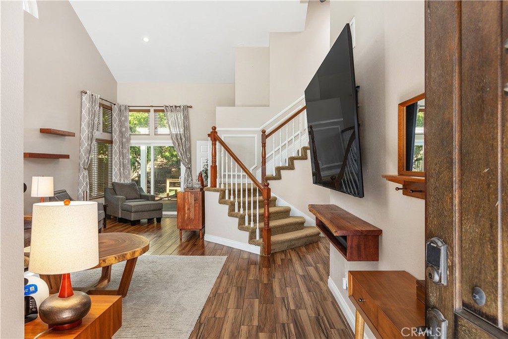 6059 Rio Valle Drive Bonsall, CA 92003 - Photo 7 of 46 New wood look tile flooring, volume ceilings