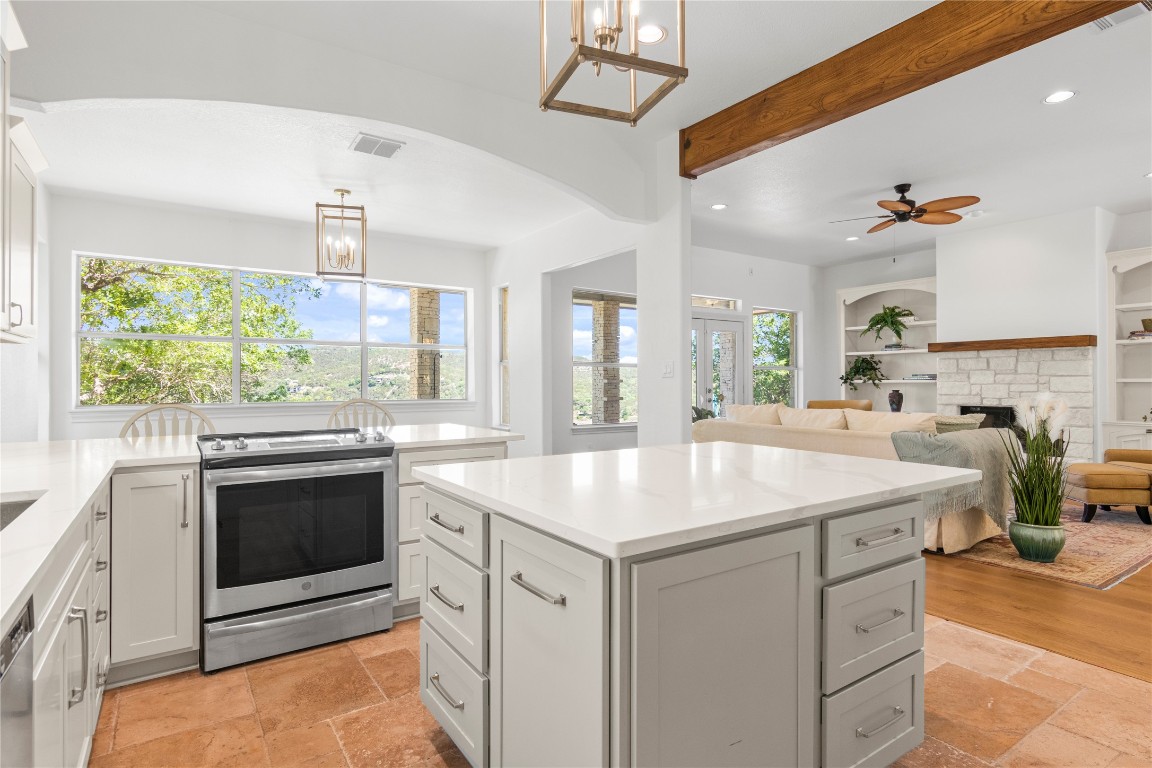 18408 West Rim Drive Jonestown, TX 78645 - Photo 12 of 30 a kitchen with a stove and a sink