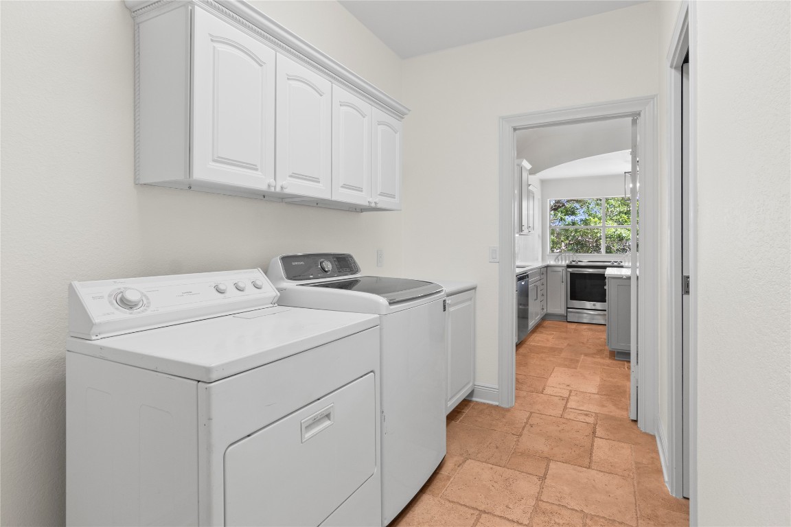 18408 West Rim Drive Jonestown, TX 78645 - Photo 13 of 30 a utility room with dryer and washer